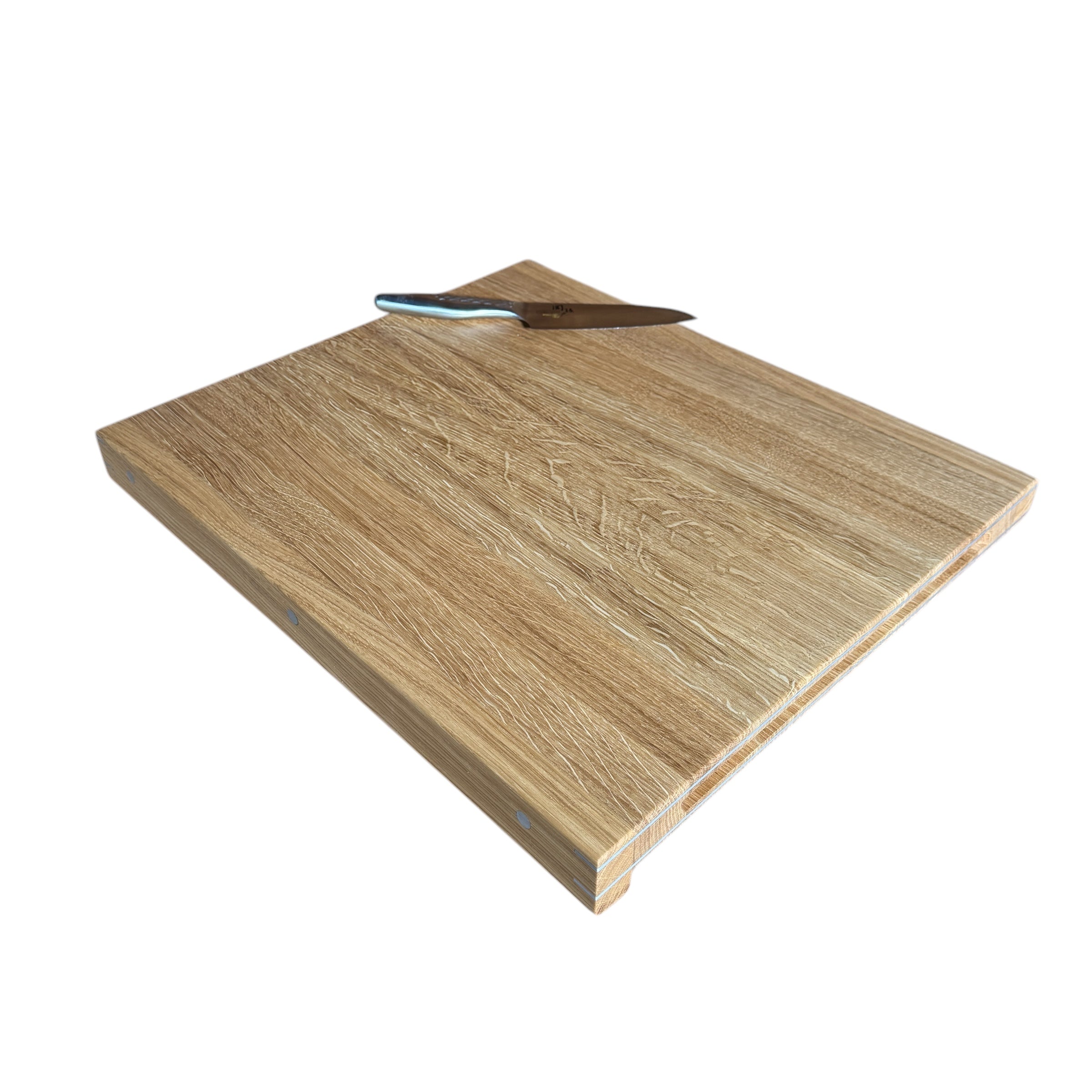 'Forefront' cutting board with wooden front edge and details in brass, copper or aluminum